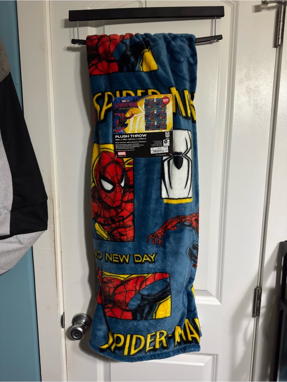 Marvel Spider-Man plush throw blanket with Spider-Man graphic and 'SPIDER-MAN